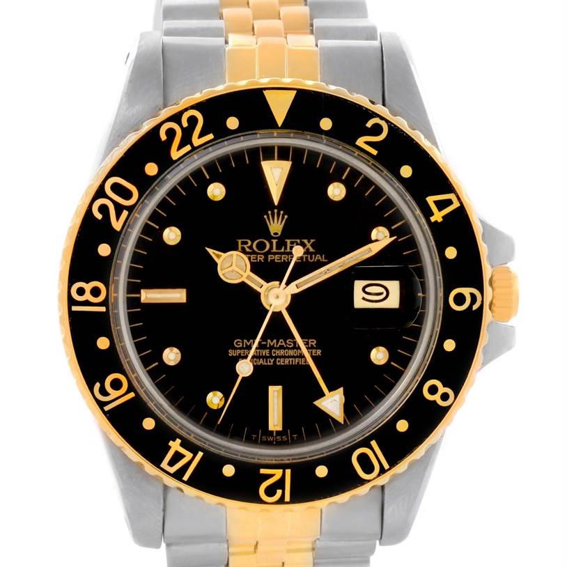This image shows the front view of a Rolex Vintage Collection 16753 Men's Stainless Steel Black Dial 16753 Men's Stainless Steel Black Dial GMT-Master watch, highlighting its black dial, gold bezel, and two-tone metal bracelet.