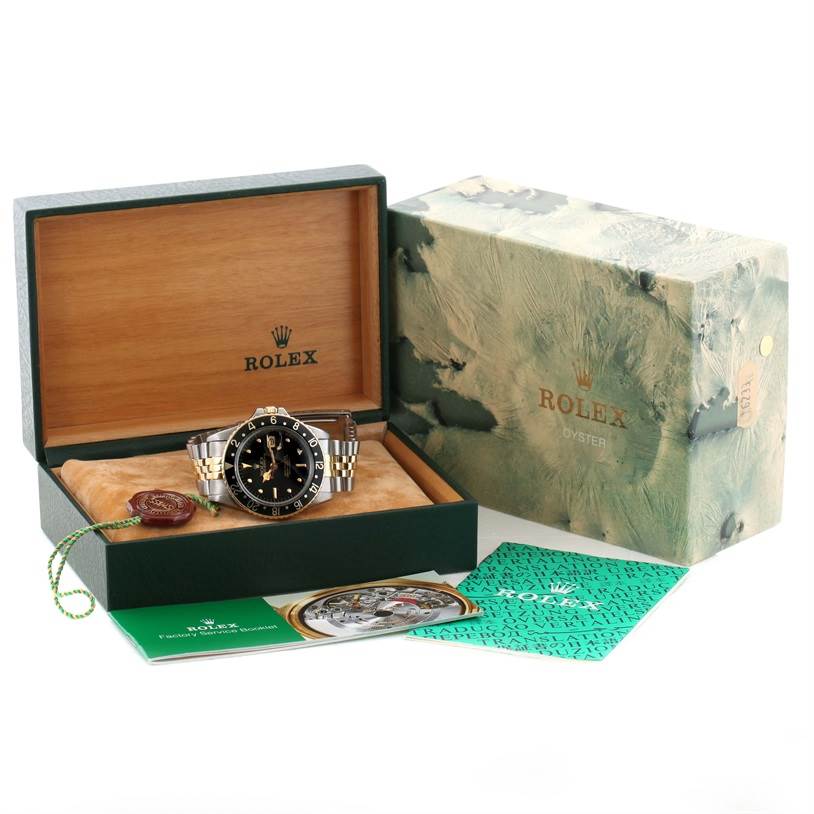 The Rolex Vintage Collection 16753 Men's Stainless Steel Black Dial 16753 Men's Stainless Steel Black Dial watch is displayed in its box, surrounded by the outer box and accompanying booklets.
