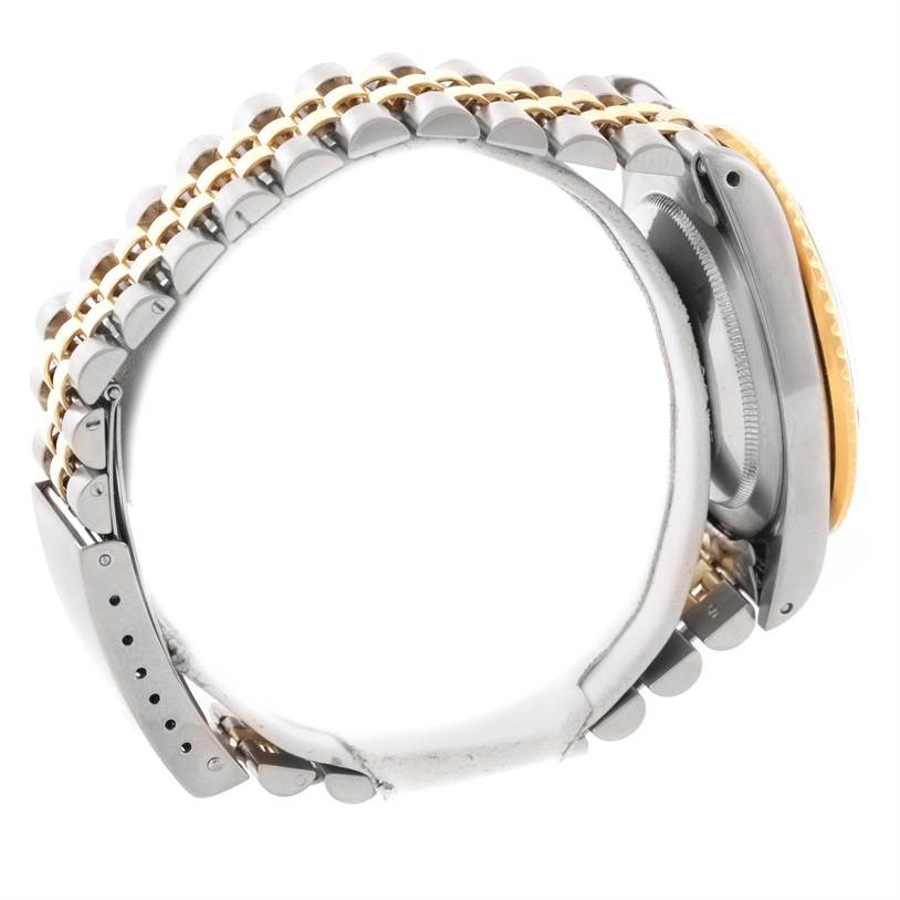 The image shows the side view of a Rolex Vintage Collection 16753 Men's Stainless Steel Black Dial 16753 Men's Stainless Steel Black Dial watch, highlighting its bracelet and case details.