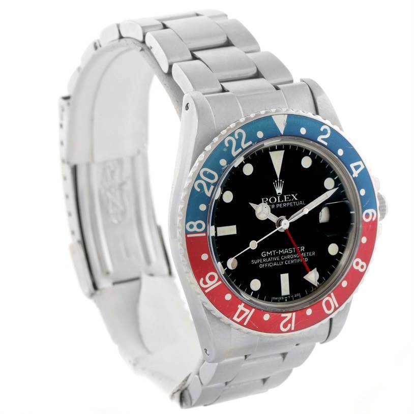 The image shows a Vintage Collection Rolex GMT-Master watch at a slight angle, highlighting its face, bezel, and part of the metal band.
