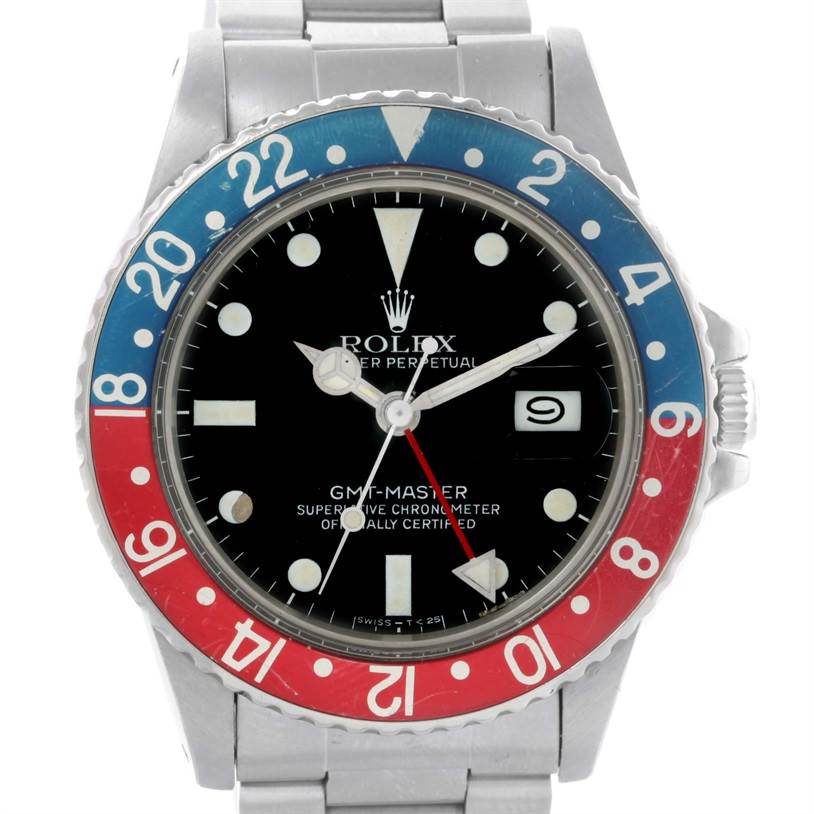 This close-up image of the Rolex GMT-Master Vintage Collection model shows the watch face and bezel at a straight-on angle.
