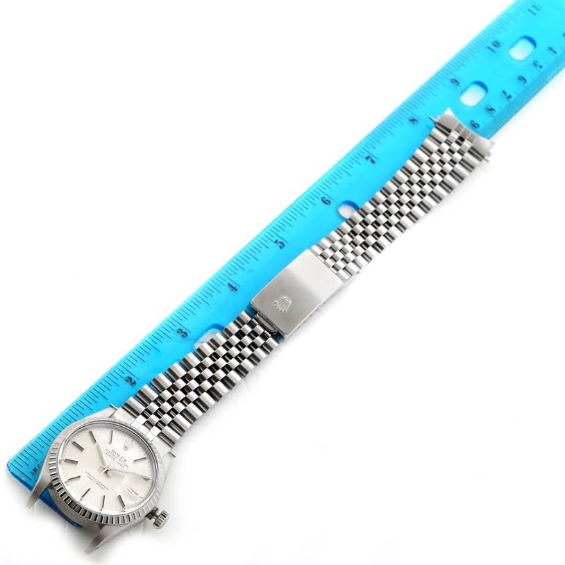 The image shows a Rolex Vintage Collection 16030 Men's Stainless Steel Silver Dial 16030 Men's Stainless Steel Silver Dial watch laid flat with a blue ruler for scale, displaying the face, bracelet, and clasp.