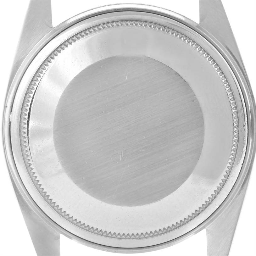 This image shows the case back of a Rolex Vintage Collection 1603 Men's Stainless Steel Silver Dial 1603 Men's Stainless Steel Silver Dial watch from a top-down angle.