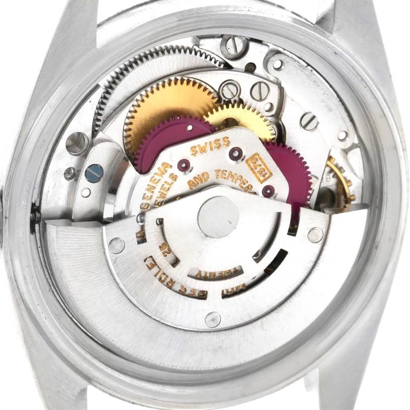 The image shows the internal mechanism of a Rolex Vintage Collection 1603 Men's Stainless Steel Silver Dial 1603 Men's Stainless Steel Silver Dial watch, focusing on its gears and movement components.