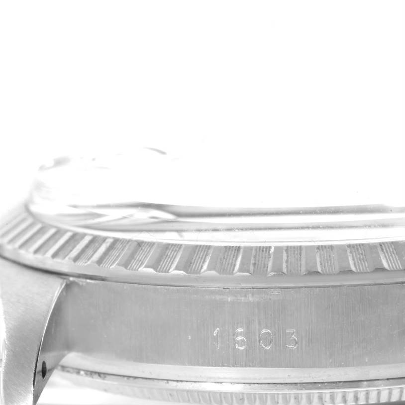 The image shows a close-up side view of the Rolex Vintage Collection 1603 Men's Stainless Steel Silver Dial 1603 Men's Stainless Steel Silver Dial model with the engraved number 1603 on the side, bezel, and crystal visible.