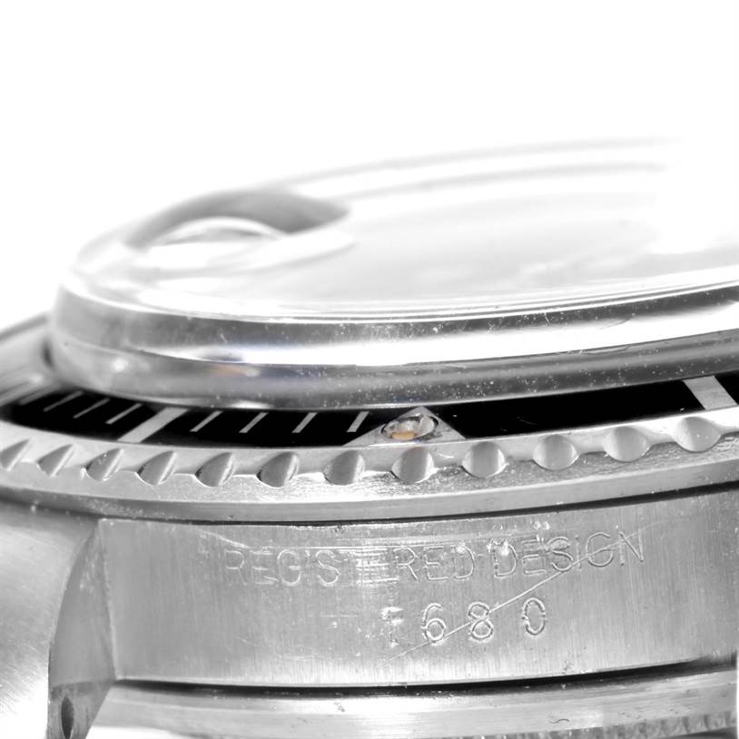 The image shows a close-up of the side bezel and case of a Rolex Vintage Collection 1680 Men's Stainless Steel Black Dial 1680 Men's Stainless Steel Black Dial watch.