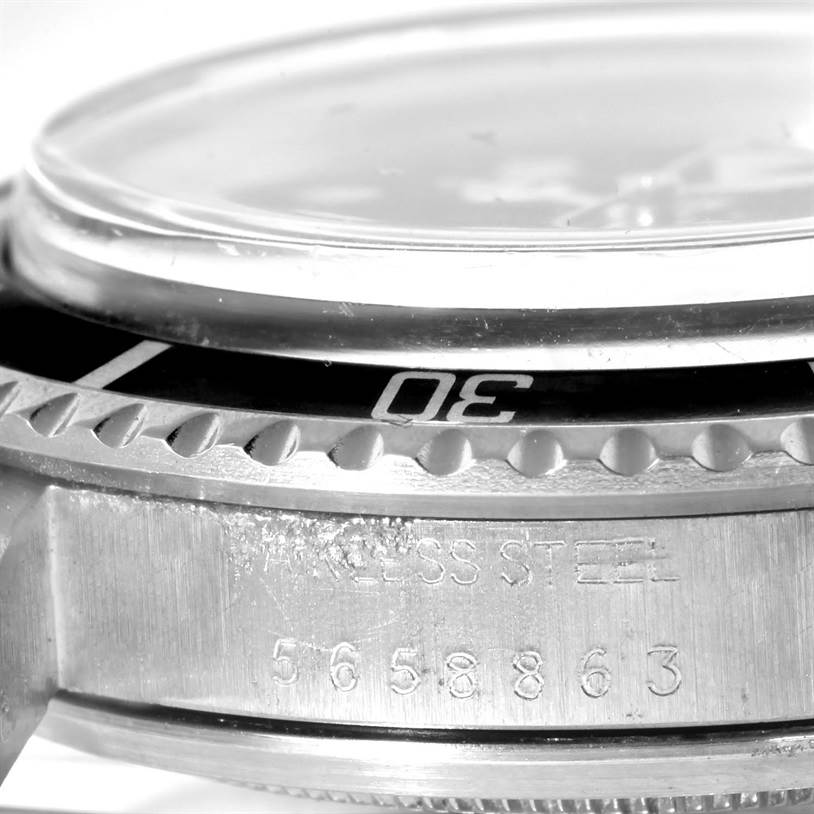 The close-up image of the Vintage Collection model by Rolex shows the side view of the case, bezel, and part of the crystal.