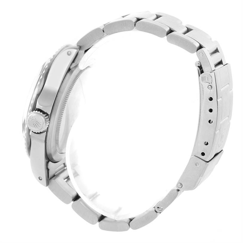 This image shows a side view of the Rolex Vintage Collection 1680 Men's Stainless Steel Black Dial 1680 Men's Stainless Steel Black Dial watch, focusing on the crown, case, and stainless steel bracelet.