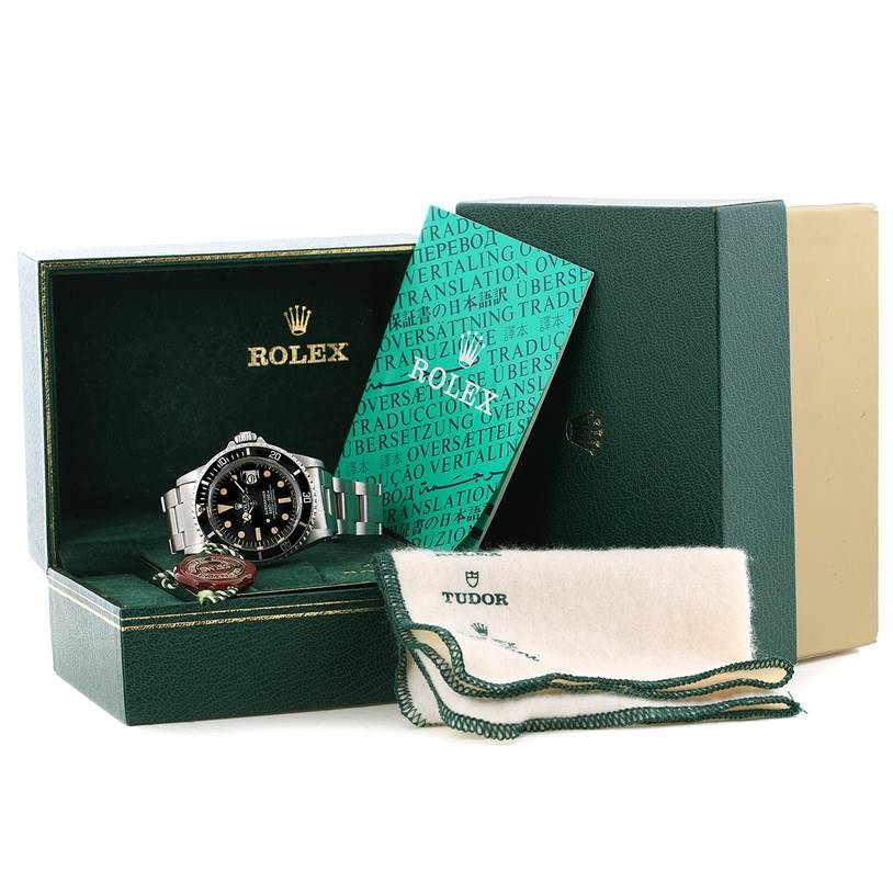 This image shows a Rolex Vintage Collection 1680 Men's Stainless Steel Black Dial 1680 Men's Stainless Steel Black Dial model watch at an angle emphasizing the watch face, alongside its box, manual, and accessories.