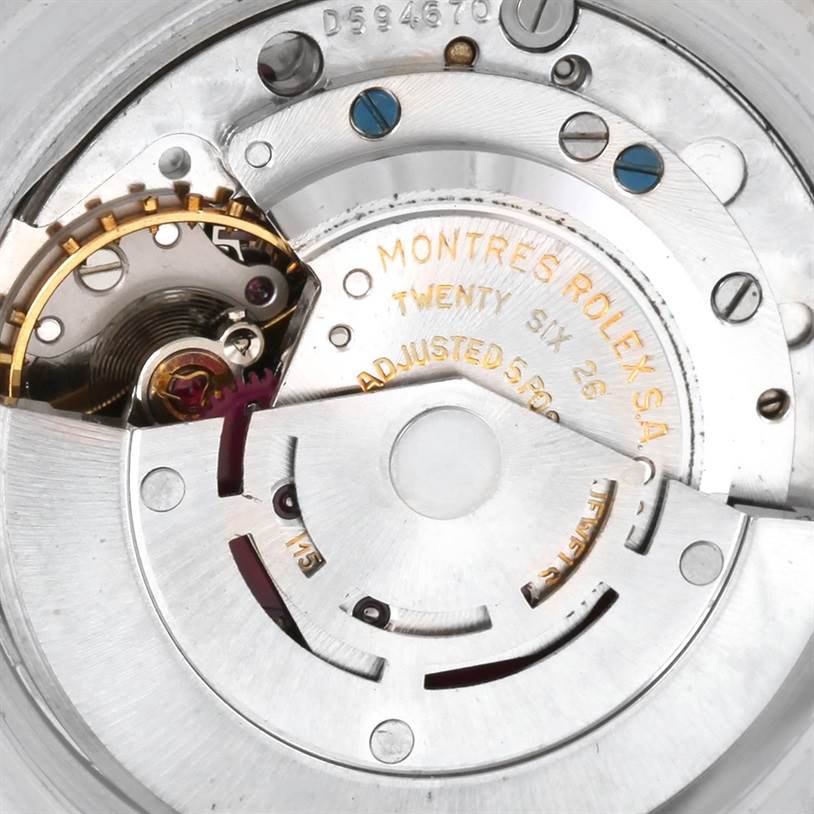 The image shows a close-up of the intricate mechanical movement inside a Vintage Collection model by Rolex.