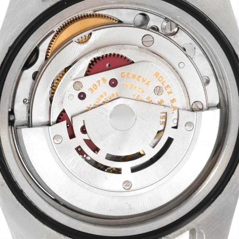 The image shows the movement of a Vintage Collection Rolex watch from the back angle, highlighting the intricate inner mechanisms.
