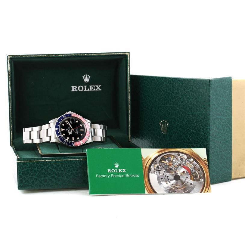 The Rolex Vintage Collection 16750 Men's Stainless Steel Black Dial 16750 Men's Stainless Steel Black Dial watch is displayed in its open box with a factory service booklet in front.