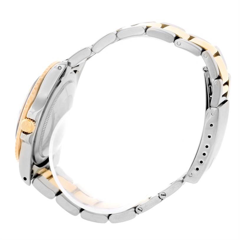 The Vintage Collection model by Rolex is shown from a side angle, highlighting its two-tone bracelet and crown.