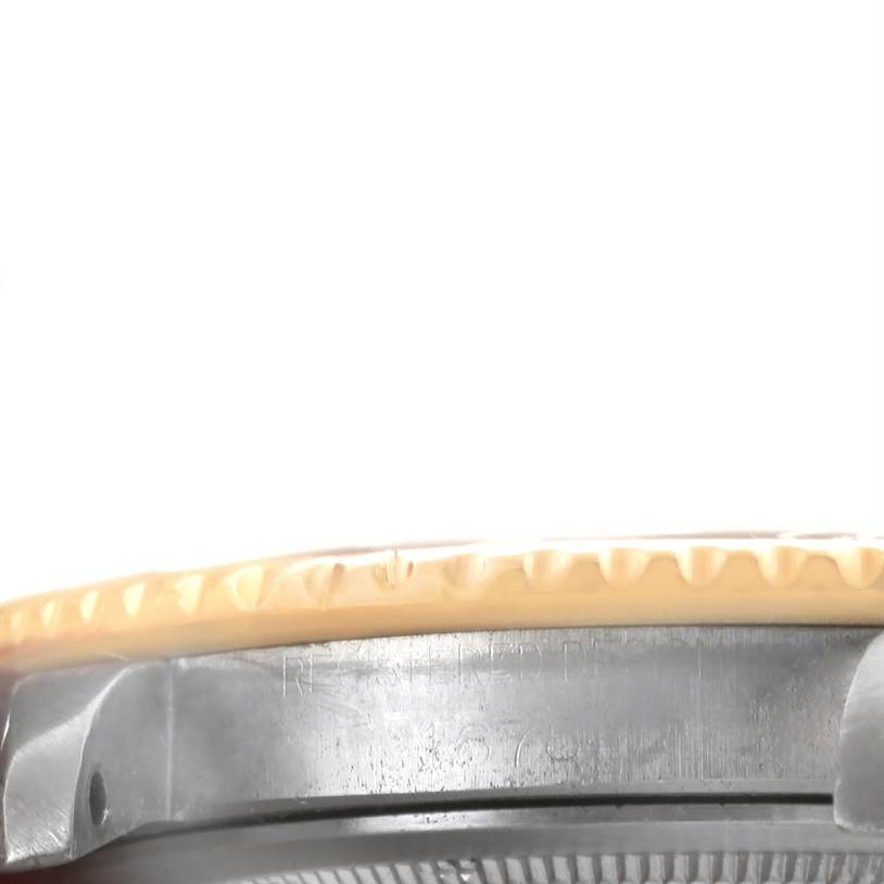 The image shows a close-up, side-view of the bezel and case of a Vintage Collection model by Rolex.