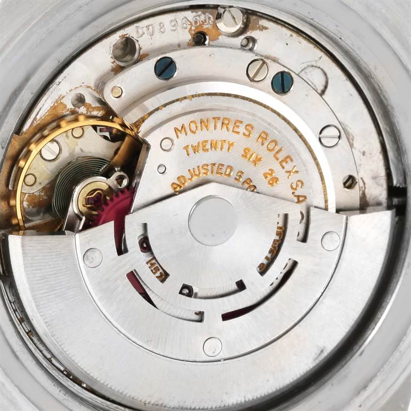 The image shows the inner mechanism of the Vintage Collection watch by Rolex, focusing on its movement components.