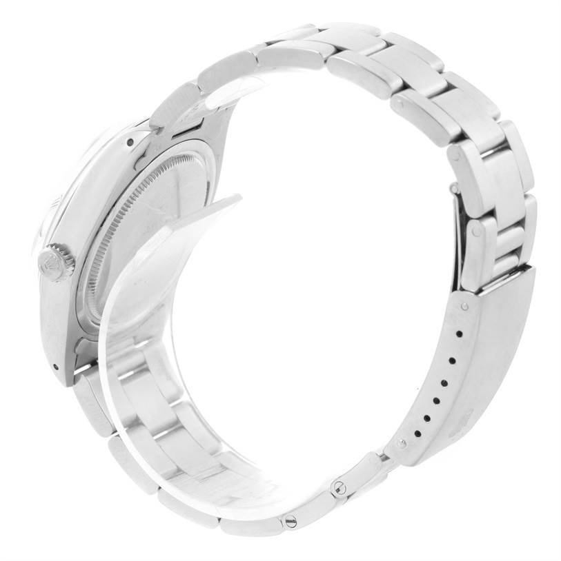 The image shows the Rolex Vintage Collection 6694 Men's Stainless Steel Black Dial 6694 Men's Stainless Steel Black Dial watch from a side angle, highlighting the case back, crown, and bracelet with clasp.