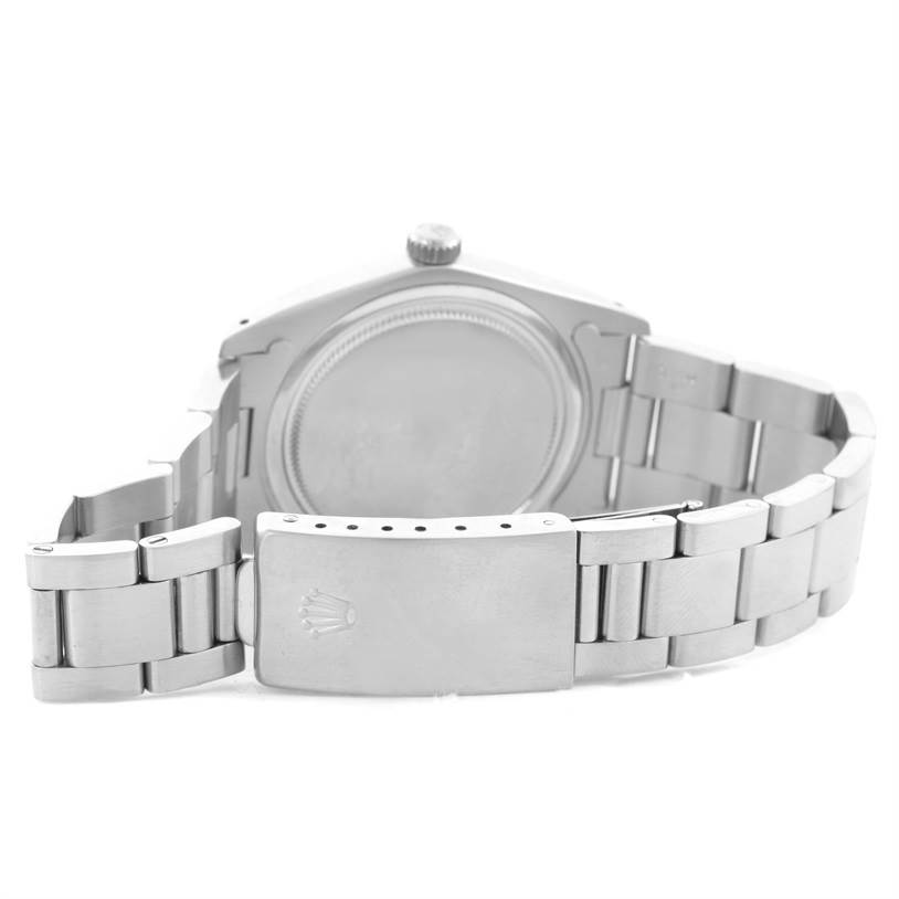 The image shows the back view of the Rolex Vintage Collection 6694 Men's Stainless Steel Black Dial 6694 Men's Stainless Steel Black Dial watch, highlighting the watch case and metal bracelet with the clasp.