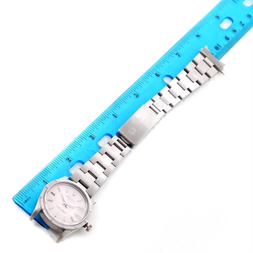 The image shows the full length of a Rolex Vintage Collection 15010 Men's Stainless Steel Silver Dial 15010 Men's Stainless Steel Silver Dial watch with the face, bracelet, and clasp, positioned next to a ruler.