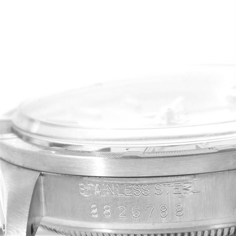 The image shows a side view of a Vintage Collection model by Rolex, highlighting its stainless steel case and serial number.