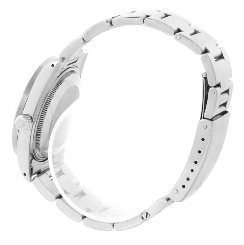 This image shows a side view of the Rolex Vintage Collection 15010 Men's Stainless Steel Silver Dial 15010 Men's Stainless Steel Silver Dial watch, highlighting its band, case, and crown.