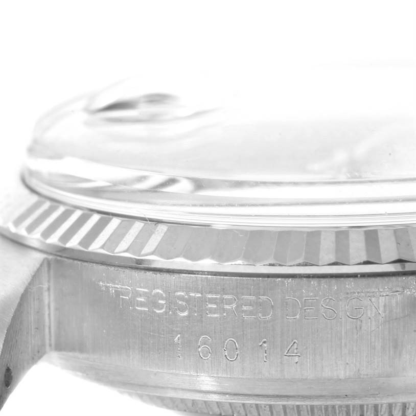 This close-up angle of the Rolex Vintage Collection 16014 Men's Stainless Steel Silver Dial 16014 Men's Stainless Steel Silver Dial model shows the side of the watch case, bezel, and crystal.