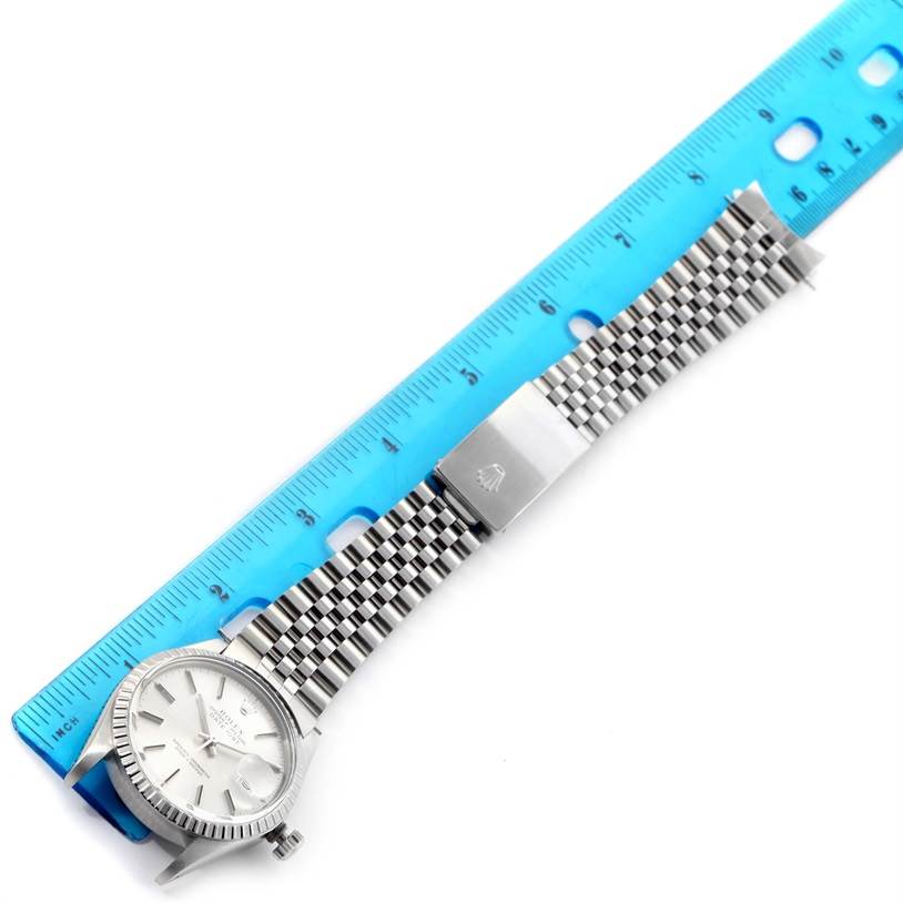 The image shows a top-down view of the Rolex Vintage Collection 16030 Men's Stainless Steel Silver Dial 16030 Men's Stainless Steel Silver Dial watch, displaying the watch face, bracelet, and clasp alongside a ruler.