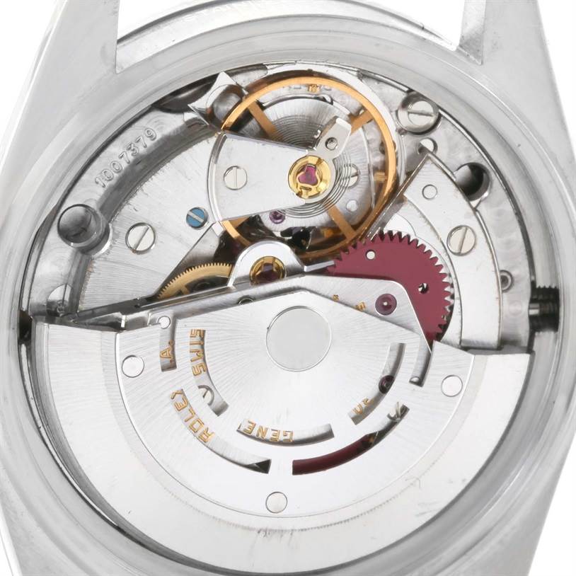 The image shows the open case back of a Rolex Vintage Collection 16030 Men's Stainless Steel Silver Dial 16030 Men's Stainless Steel Silver Dial model, revealing the intricate mechanical movement inside.