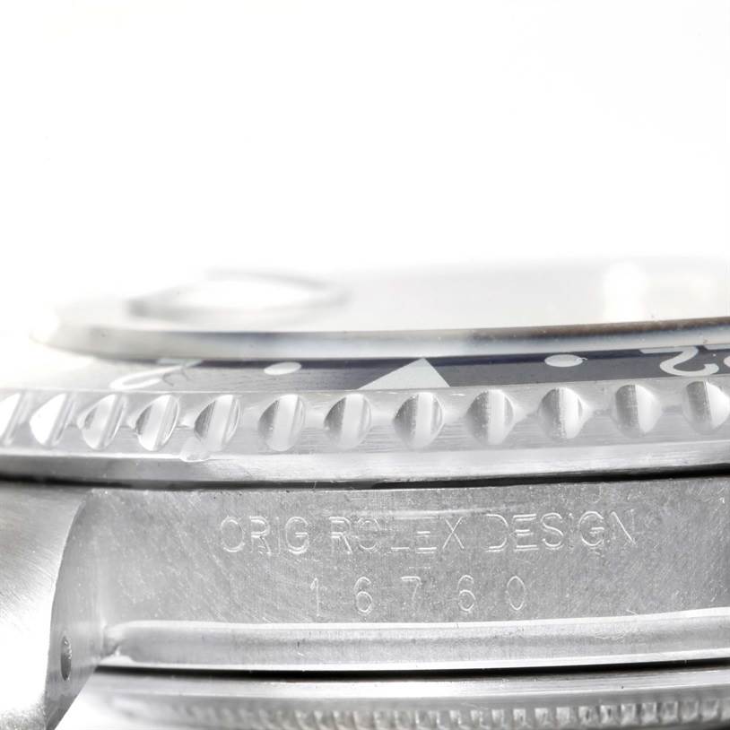 This image shows a close-up side view of a Rolex Vintage Collection 16760 Men's Stainless Steel Black Dial 16760 Men's Stainless Steel Black Dial watch bezel and part of the case, with the model number 16760 engraved.