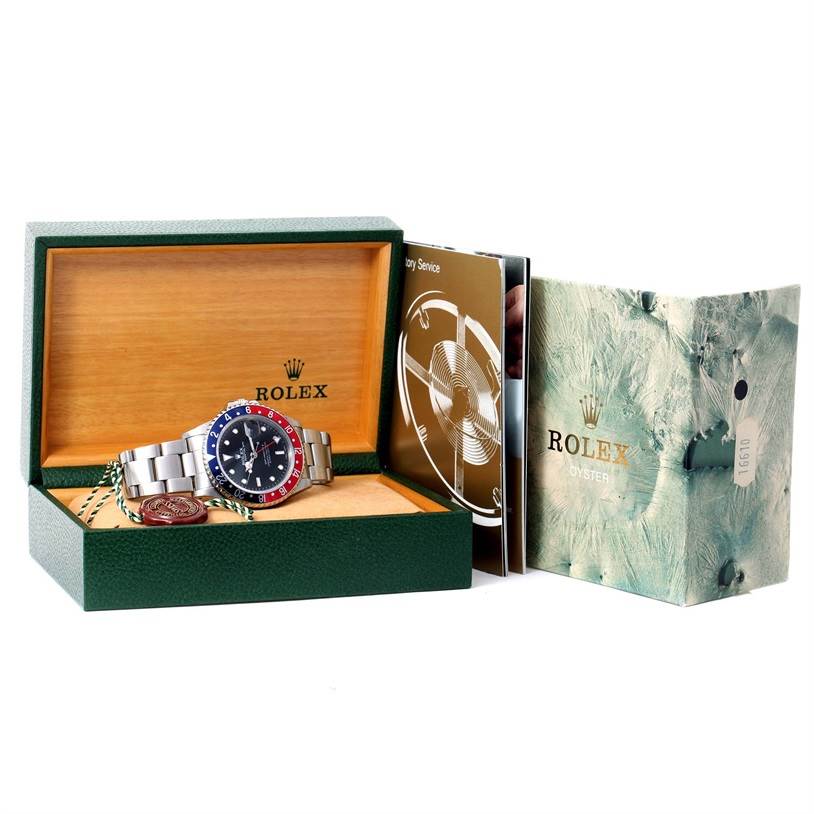 The Rolex Vintage Collection 16760 Men's Stainless Steel Black Dial 16760 Men's Stainless Steel Black Dial watch is shown at a front angle, inside its open green and wood box, along with accompanying booklets.