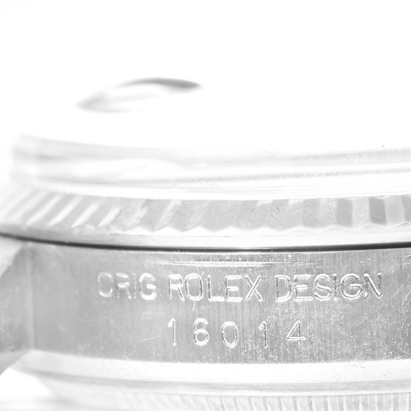 Close-up of the bezel, crystal, and casing showing "ORIG ROLEX DESIGN" and model number of the Vintage Collection Rolex watch.