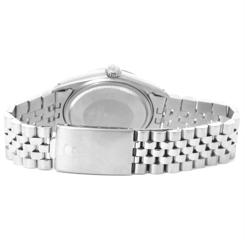 The image shows the back case and a closed clasp of the bracelet of the Rolex Vintage Collection 16014 Men's Stainless Steel White Dial 16014 Men's Stainless Steel White Dial watch.