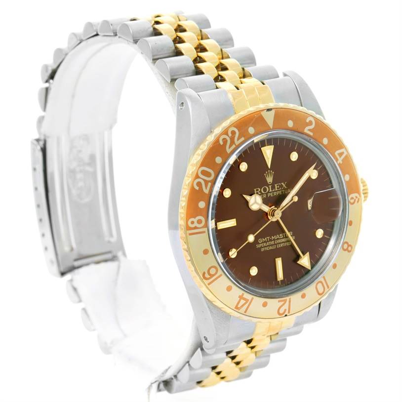 This image shows a side angle of the Rolex Vintage Collection 16753 Men's Stainless Steel Brown Dial 16753 Men's Stainless Steel Brown Dial GMT-Master wristwatch, highlighting its face, bezel, band, and clasp.