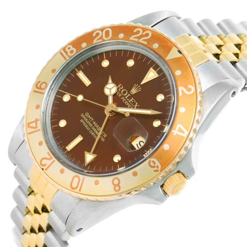 The image shows an angled view of the Rolex GMT-Master Vintage Collection watch, highlighting its gold and stainless steel bracelet and bezel.