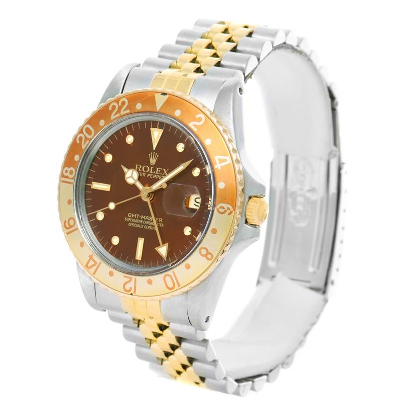 This Rolex Vintage Collection 16753 Men's Stainless Steel Brown Dial 16753 Men's Stainless Steel Brown Dial GMT-Master watch is shown at an angle, displaying its face, bezel, and bracelet clearly.