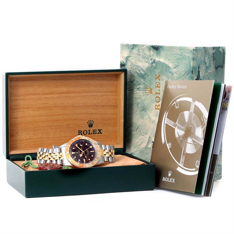 The image shows a Rolex Vintage Collection 16753 Men's Stainless Steel Brown Dial 16753 Men's Stainless Steel Brown Dial watch in its open box alongside service booklets and packaging from a front angle.