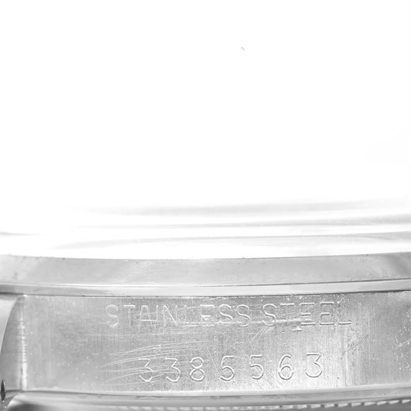 The image shows the side of a Rolex Vintage Collection 6426 Men's Stainless Steel Silver Dial 6426 Men's Stainless Steel Silver Dial watch, focusing on its stainless steel case and serial number.