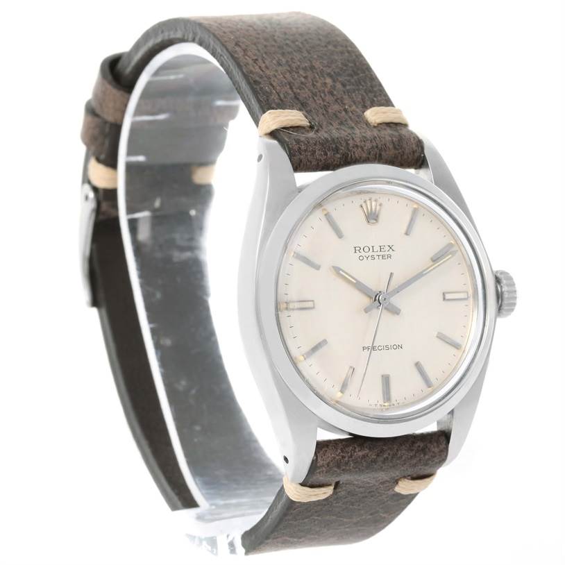 The Vintage Collection Rolex watch is shown at a slight angle, revealing its face, case, and leather strap.