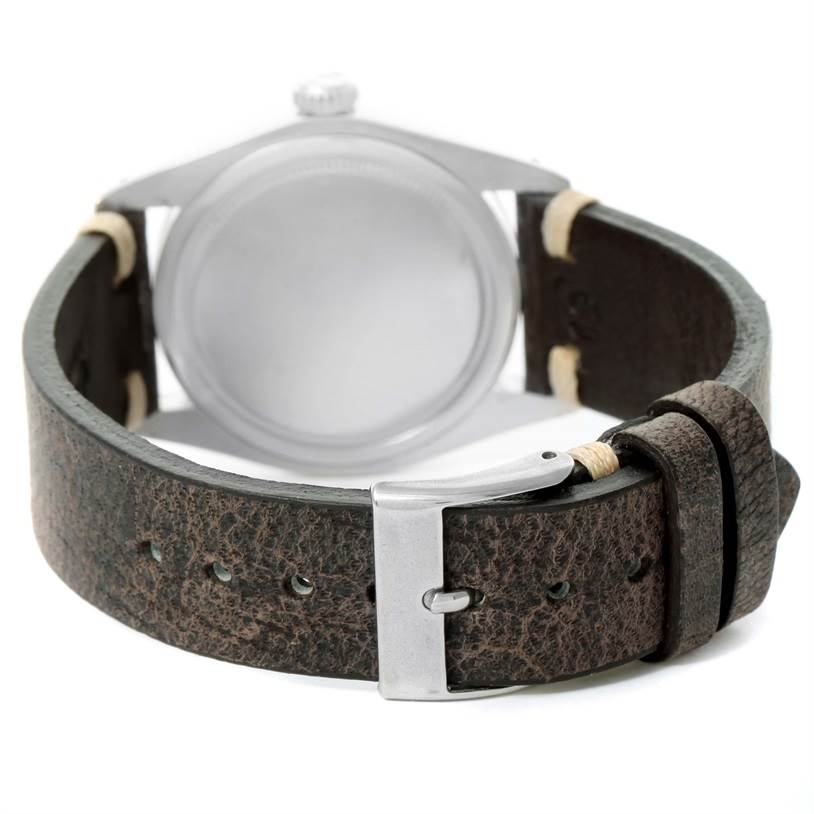 The image displays the back of the Rolex Vintage Collection 6426 Men's Stainless Steel Silver Dial 6426 Men's Stainless Steel Silver Dial watch, showing its leather strap and buckle.