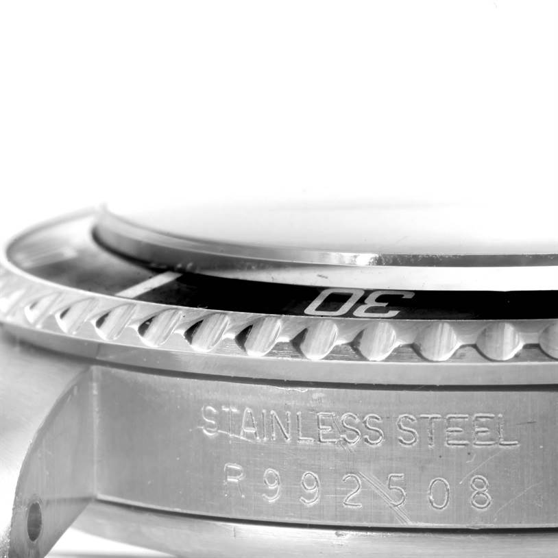 The image shows the side view of the bezel and part of the case with the serial number of a Rolex Vintage Collection 5513 Men's Black Dial 5513 Men's Black Dial watch in stainless steel.
