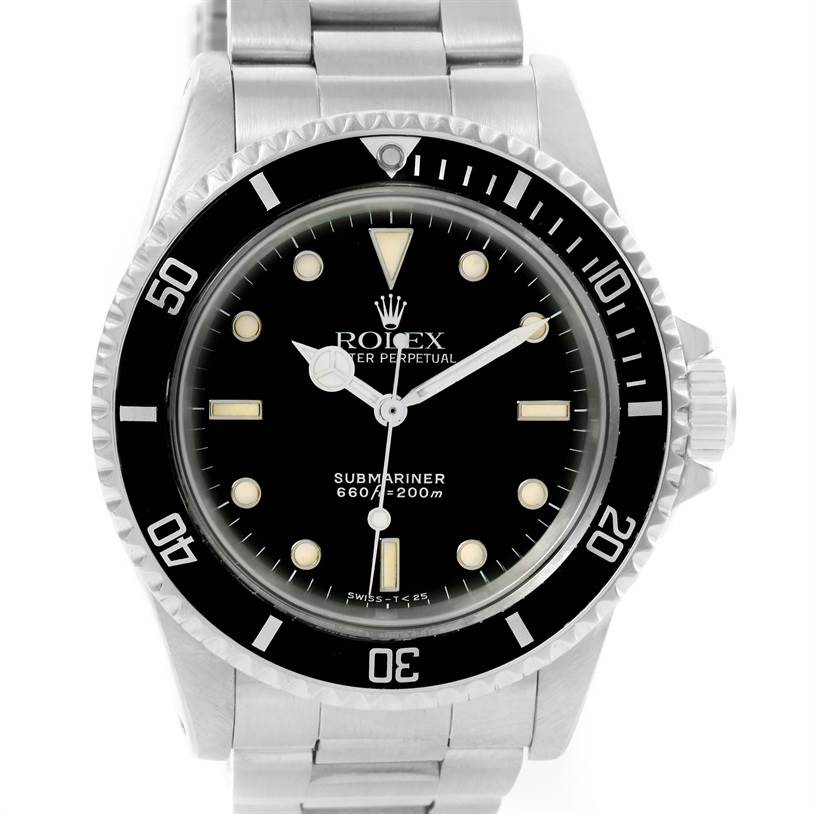 The image shows a front view of the Rolex Submariner from the Vintage Collection, highlighting the watch face and bracelet.