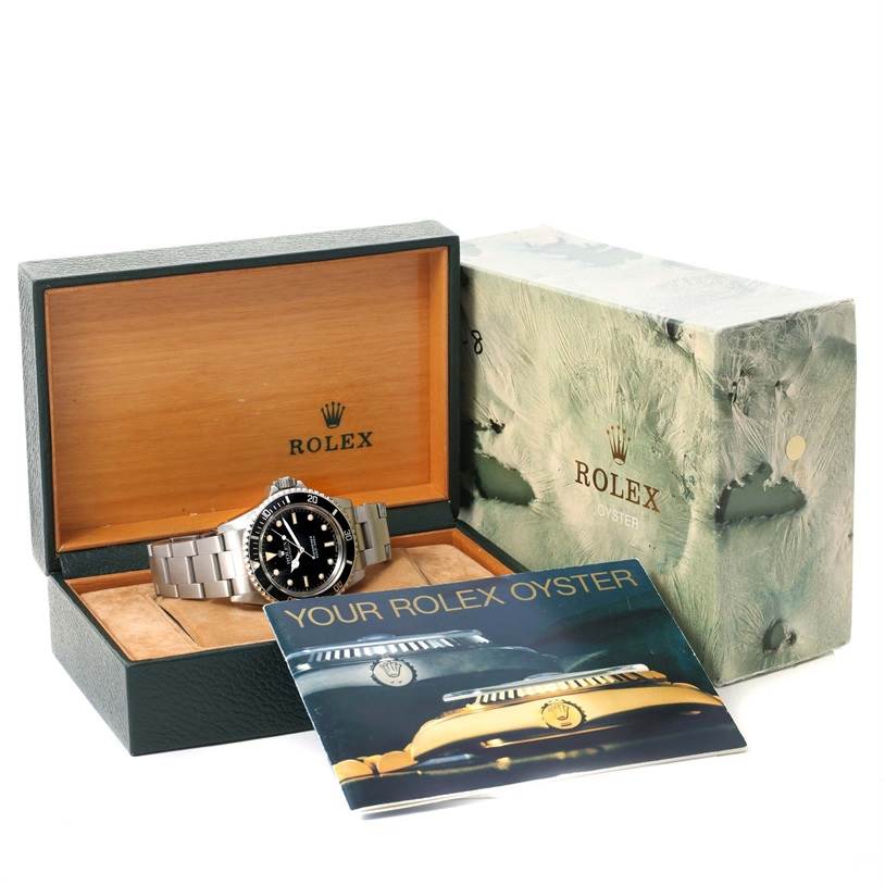 The image shows a Rolex Vintage Collection 5513 Men's Black Dial 5513 Men's Black Dial watch in its open box, alongside the outer box and a booklet.