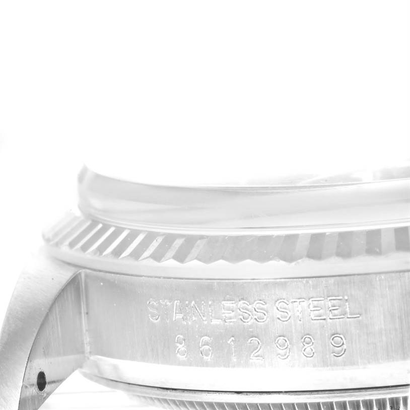 The image shows a close-up side view of the stainless steel casing and bezel of the Rolex Vintage Collection 16014 Men's Stainless Steel Silver Dial 16014 Men's Stainless Steel Silver Dial watch.