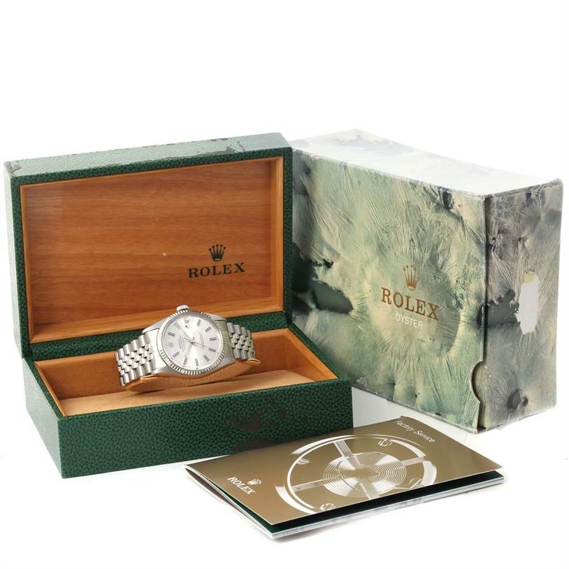 The image shows a Rolex Vintage Collection 16014 Men's Stainless Steel Silver Dial 16014 Men's Stainless Steel Silver Dial watch in its box, accompanied by the outer box and instruction manual.