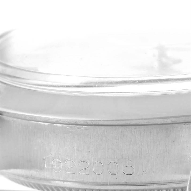 This image shows a close-up of the side of the Vintage Collection model by Rolex, featuring part of the case and serial number.