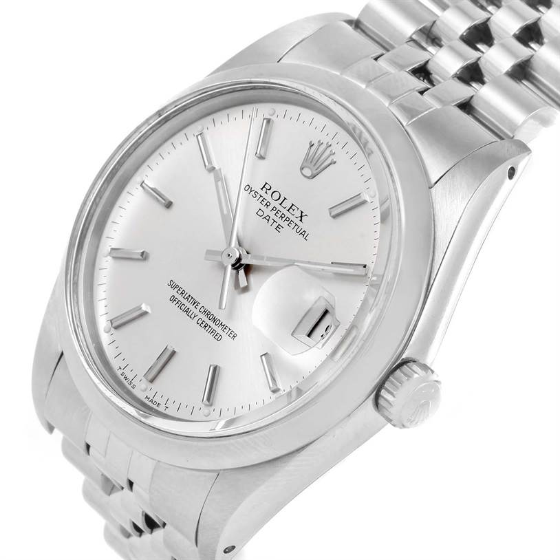 The image shows a close-up, angled view of the face, crown, and part of the bracelet of the Rolex Vintage Collection 15000 Men's Stainless Steel Silver Dial 15000 Men's Stainless Steel Silver Dial Oyster Perpetual Date watch.