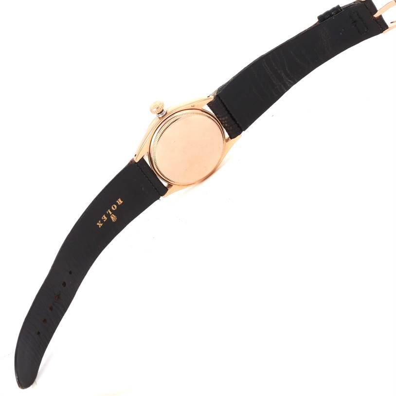 The image shows the backside and the strap of a Rolex Vintage Collection 6284 Men's Rose Gold Silver Dial 6284 Men's Rose Gold Silver Dial model watch.