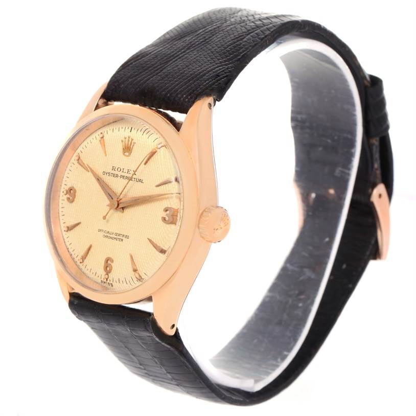 The watch is a Rolex Vintage Collection 6284 Men's Rose Gold Silver Dial 6284 Men's Rose Gold Silver Dial model, shown at an angle highlighting the dial, case, crown, and leather strap.