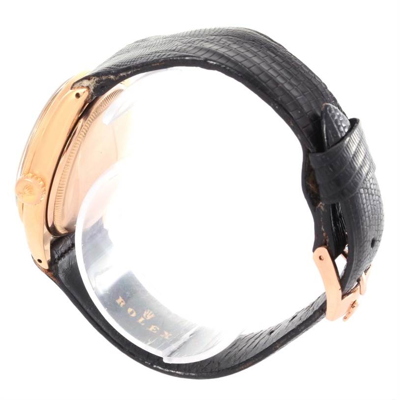 Side view of the Rolex Vintage Collection 6284 Men's Rose Gold Silver Dial 6284 Men's Rose Gold Silver Dial watch showing the crown, case, and black leather strap with a partly visible buckle.