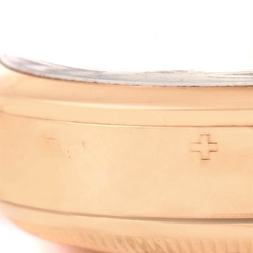 This image shows a close-up side view of a Rolex Vintage Collection 6284 Men's Rose Gold Silver Dial 6284 Men's Rose Gold Silver Dial watch, focusing on its gold-colored case.