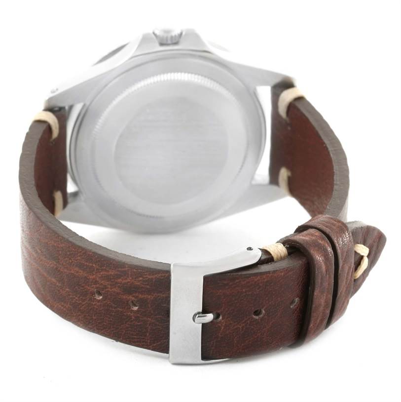 This image shows the back view of the Rolex Vintage Collection 1675 Men's Stainless Steel Black Dial 1675 Men's Stainless Steel Black Dial watch, highlighting the case back and brown leather strap with clasp.